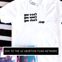 White unisex tshirt with retro graphic lettering "you can't, you won't, you don't stop" in black.