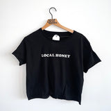 Black, cropped tshirt with white flocked lettering "LOCAL HONEY"